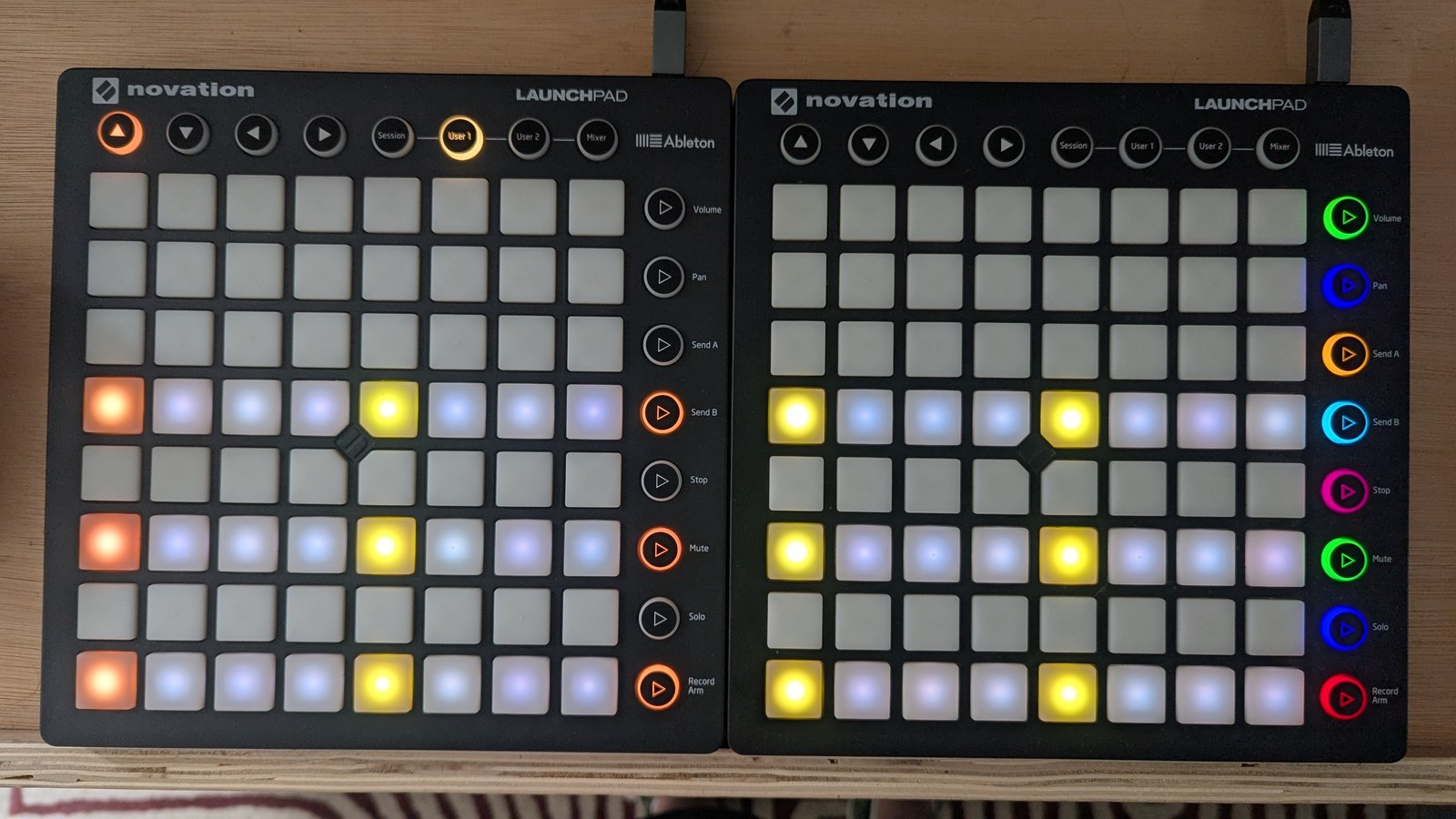 The same filled pattern with the row buttons now orange and the step 1 pads washed out where the playhead sits, photographed on the hardware