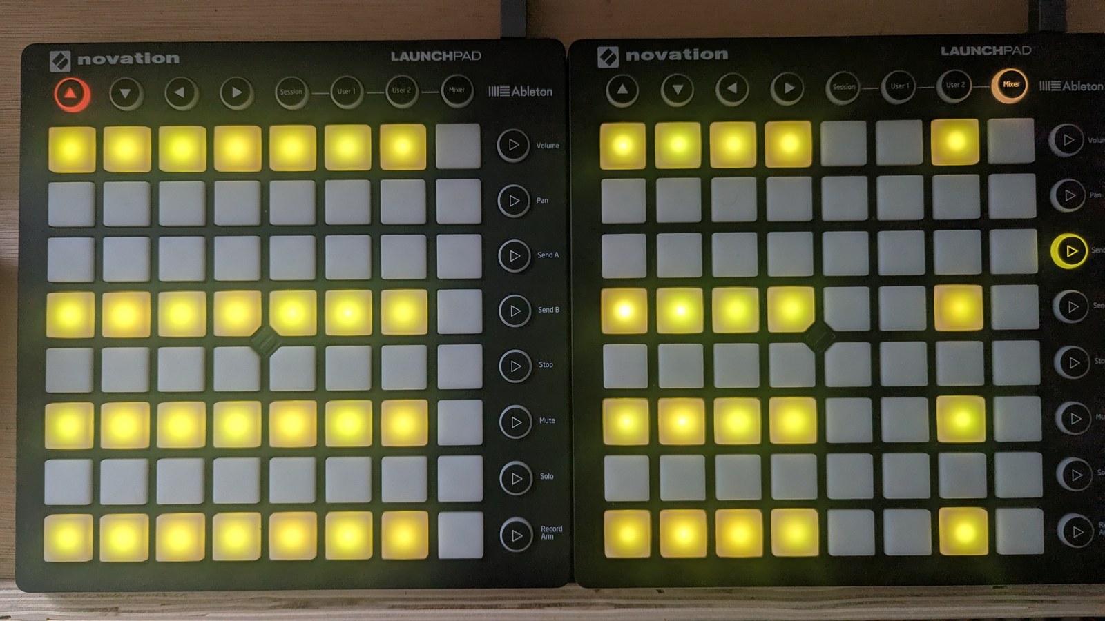 A chord-edit grid where twelve columns each show the same four lit acid-yellow pads, on the top row and the fourth, sixth and eighth rows down, while columns 8, 13, 14 and 16 are entirely unlit, photographed on the hardware