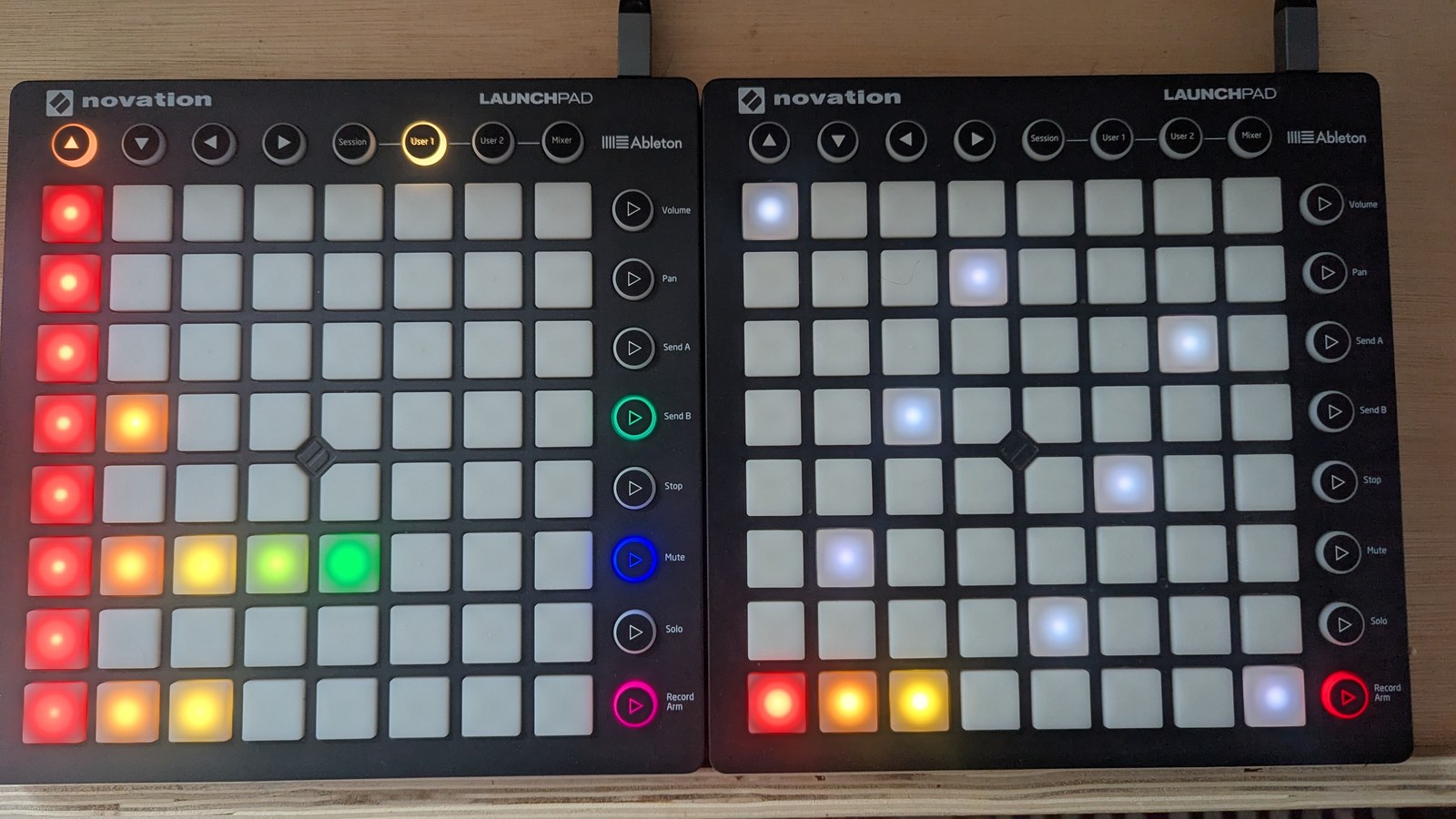 A note-arp view: the LP LHS's first column is red on every row, with runs of two, five and three coloured pads on three of them; the LP RHS shows eight visible slate-grey keyboard anchors and three adjacent pitches lit red, orange and mustard along the bottom, photographed on the hardware