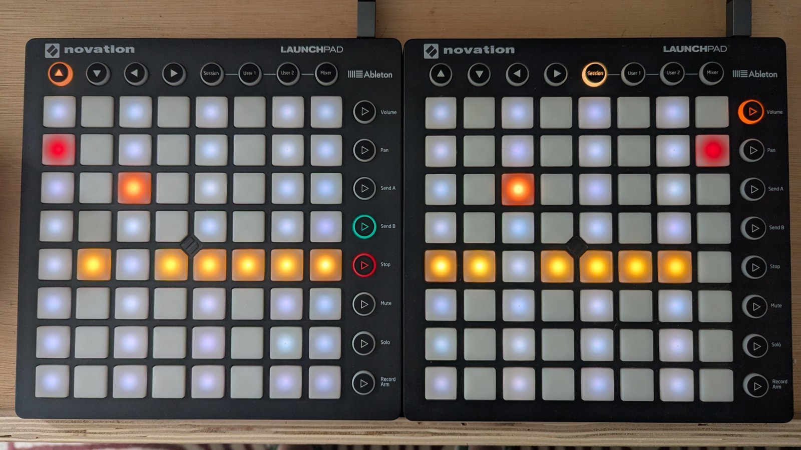 A TR-8 accent grid: most steps show a mustard pad at height 3, steps 3 and 11 sit higher in orange, steps 1 and 16 higher again in dark red, and nine of the sixteen columns are shaded slate behind the contour, photographed on the hardware