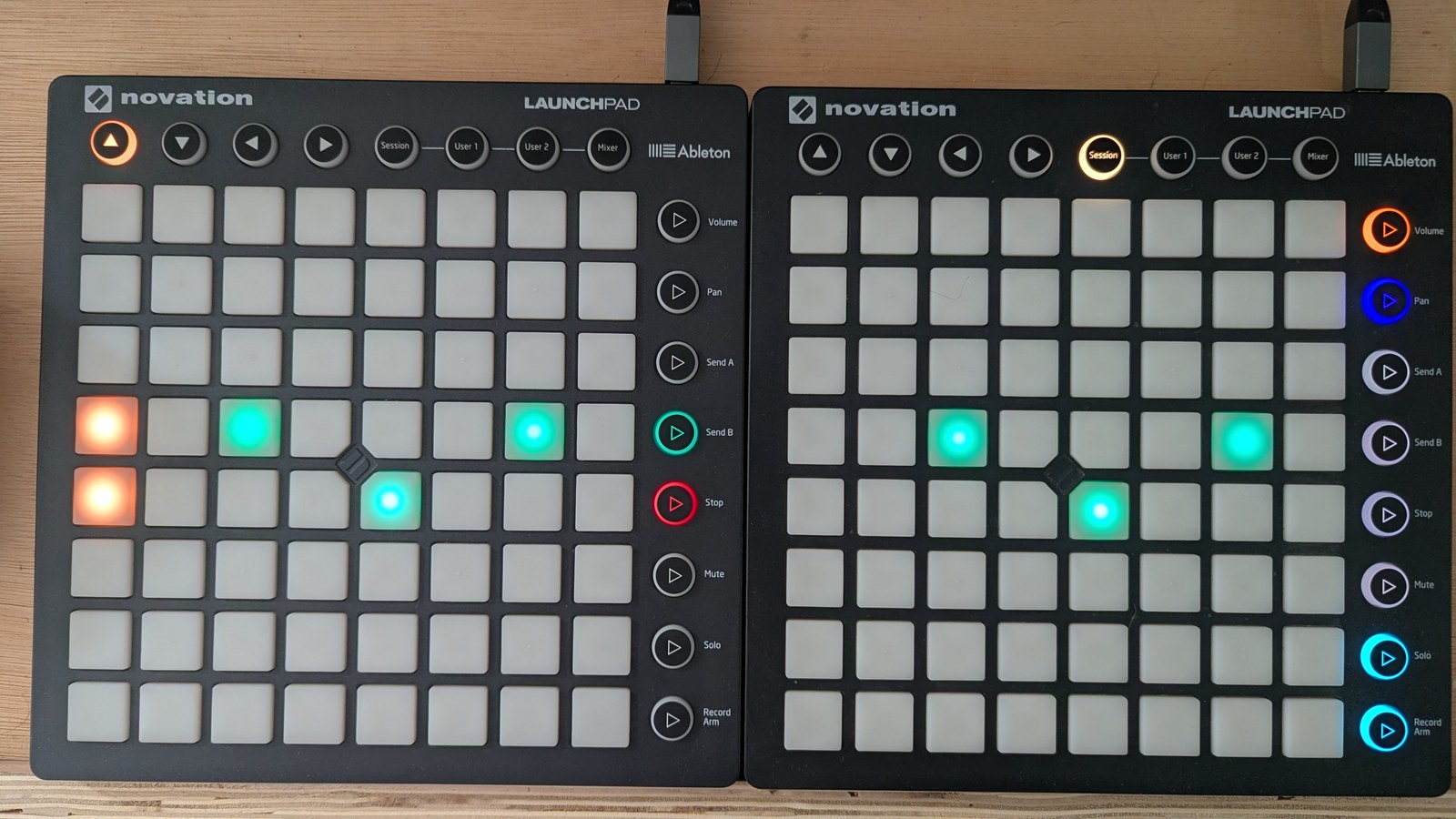 The TR-8 alternate view: four evenly spaced trigs on the closed-hat row and two on the clap row below it, with the row buttons coloured green for the hats and red for the claps, photographed on the hardware
