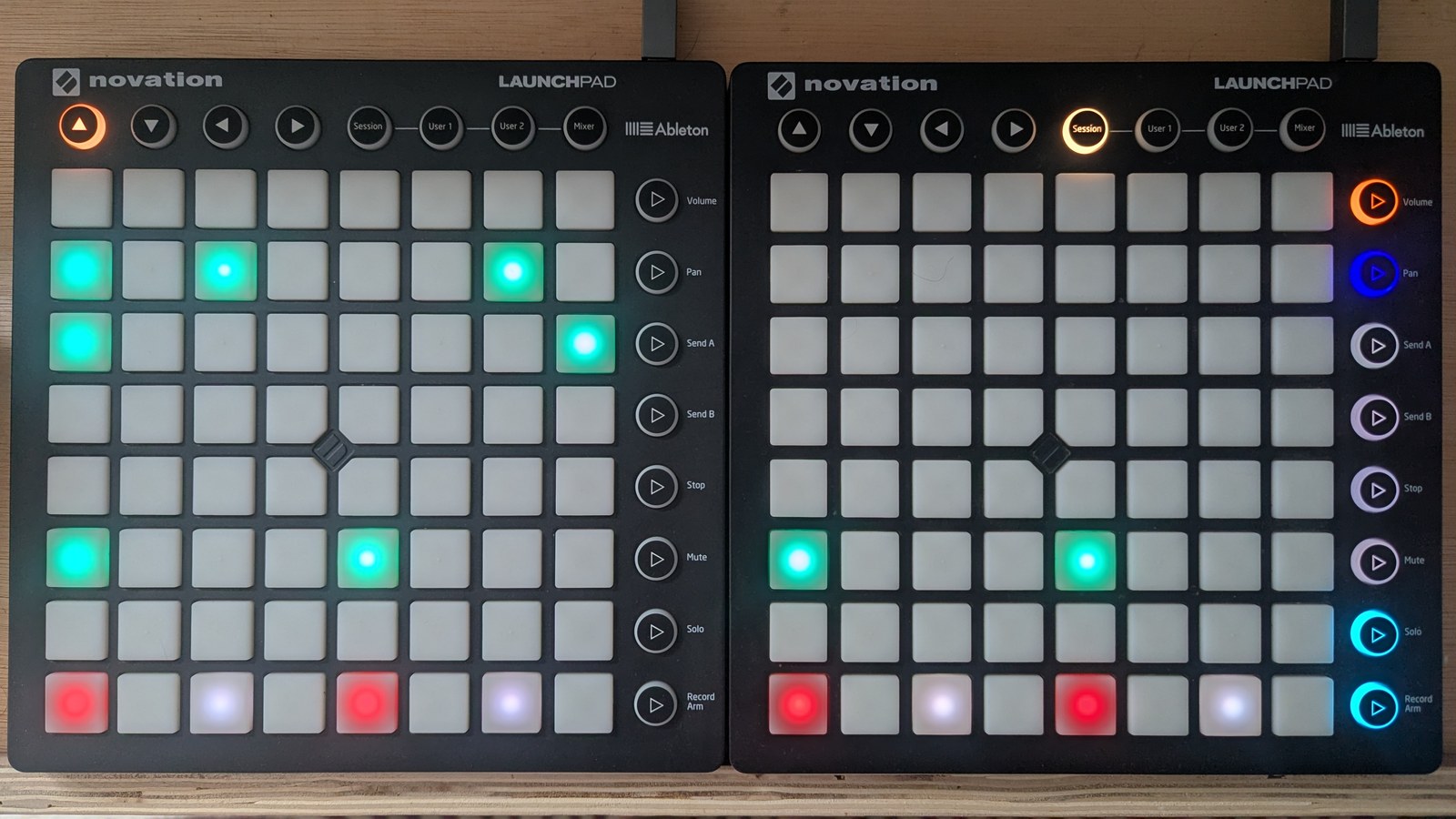 The TR-8 main view: a kick row has teal trigs on all four beats, two tom rows above carry five more teal trigs, all row buttons are dark because the rows are muted, and the bottom control row alternates dark red beat pads with slate off-eighth pads, photographed on the hardware